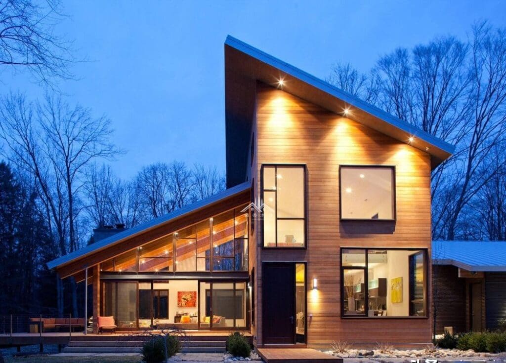 A contemporary home with a lean-to roof and glass room.