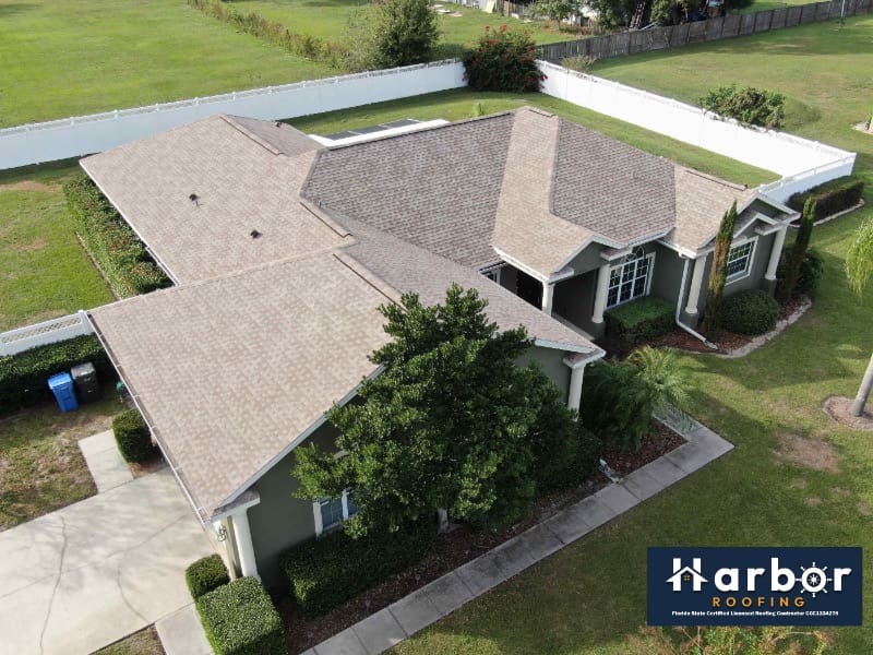 House with brown new roof placed by Harbor Roofing